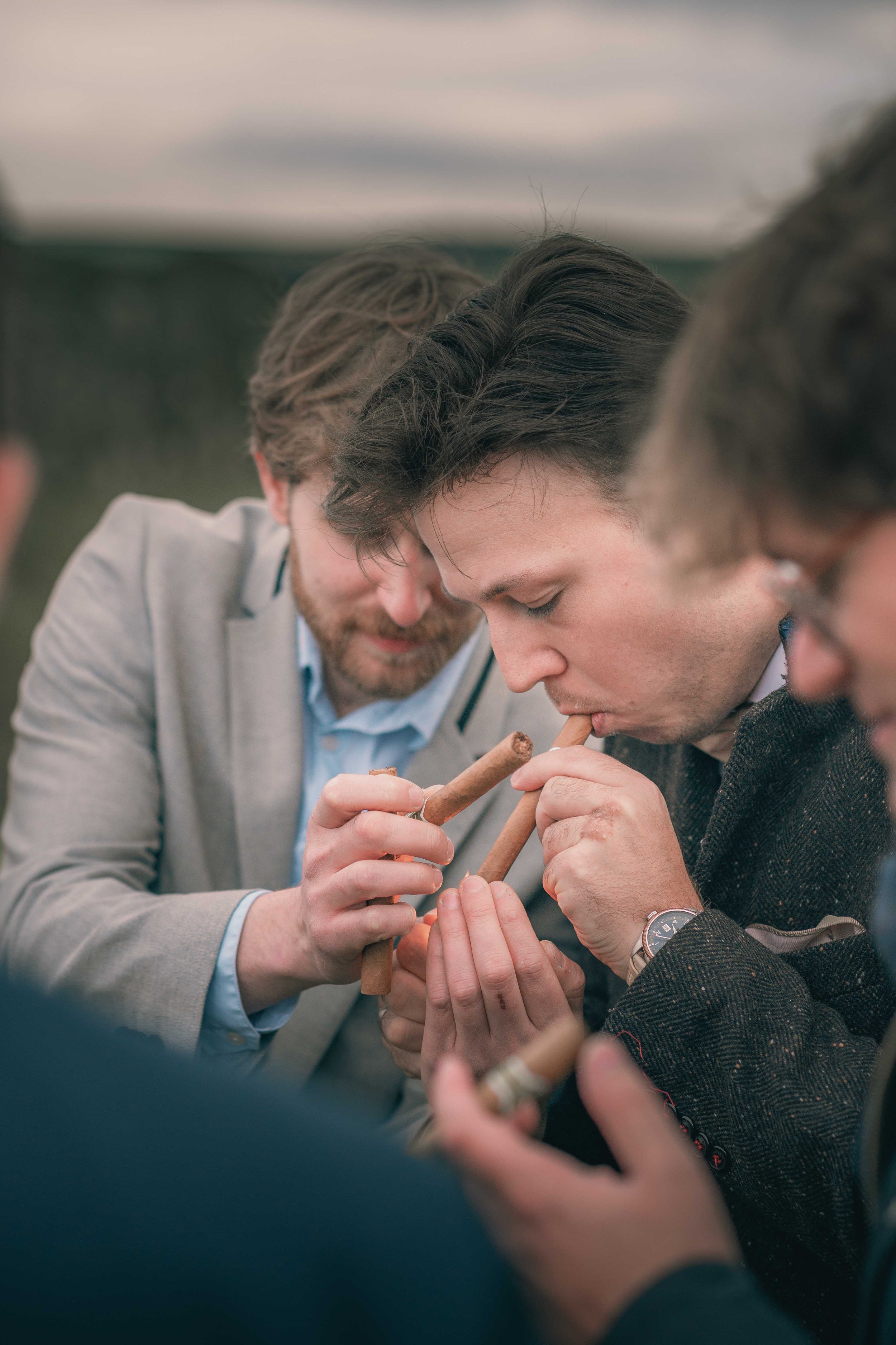 Christopher_James_Photography_Northern_Ireland_Groom_celebrating_with_bestmen_cigar.jpg